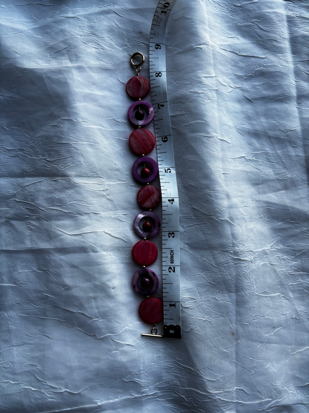 Handmade pink and purple dyed shell bracelet